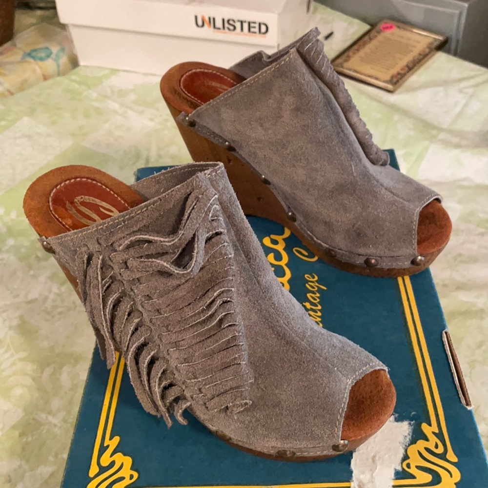 Suede wedges with fringe and studded sides.